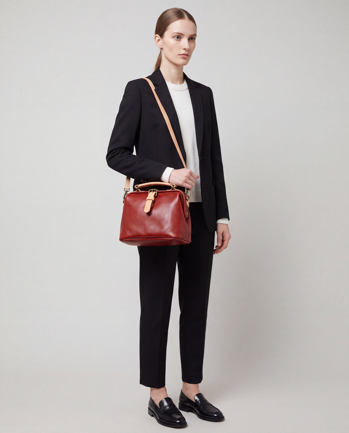 Mini Leather Bag bag in Red – worn by model, close-up