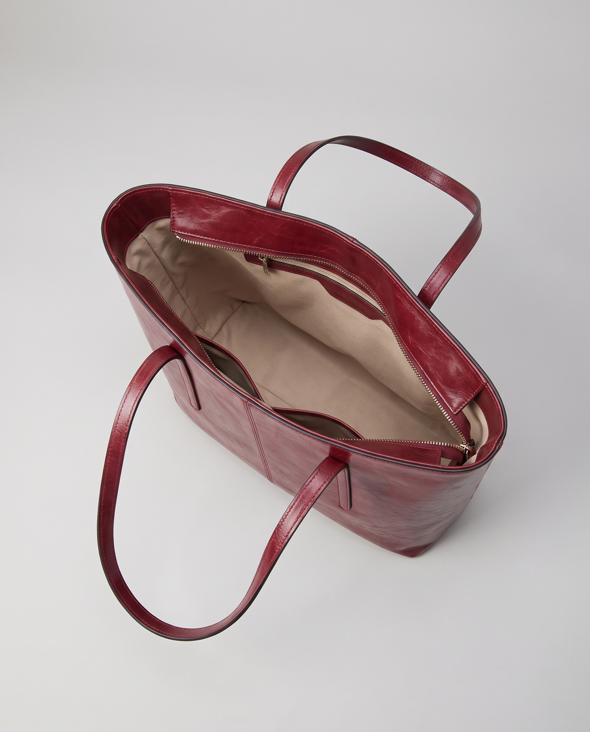 Molo oil-waxed leather tote in red, open showing interior