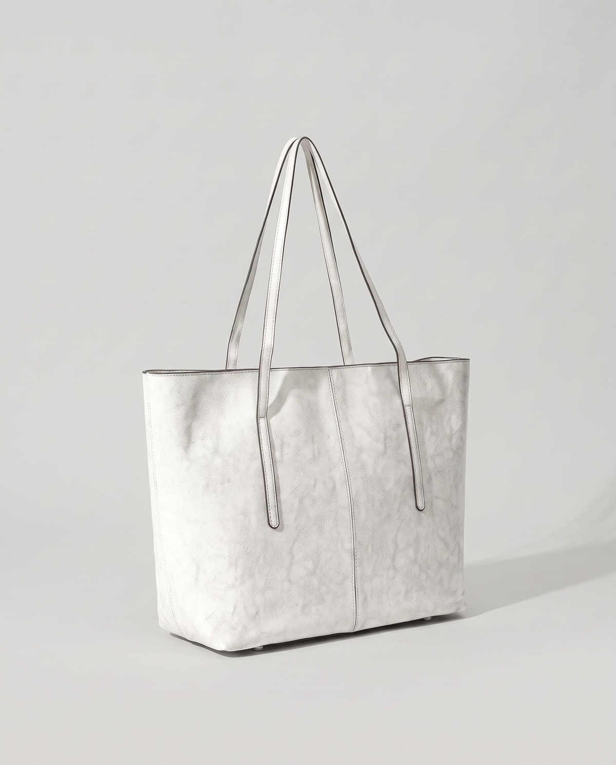 Molo oil-waxed leather tote in white, three-quarter view