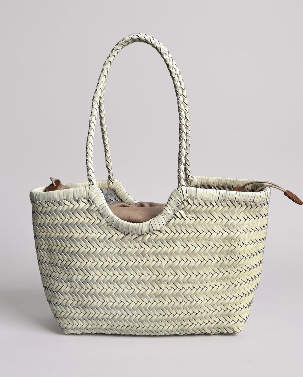 Hardware and handle detail on the Valentina Noto Large bag in White