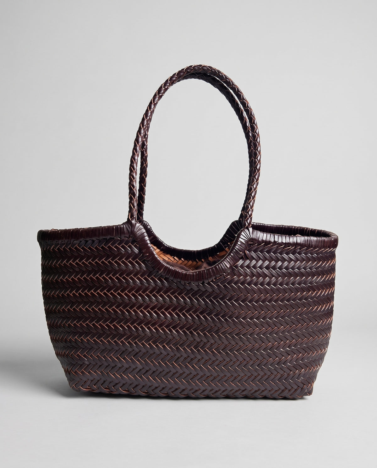 Hardware and handle detail on the Valentina Noto Small bag in Chocolate