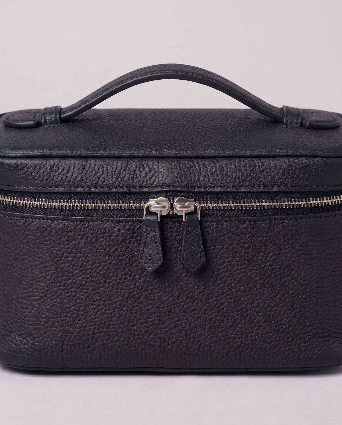 Silver zip and handle detail on the Valentina Orvieto Small bag in Black leather