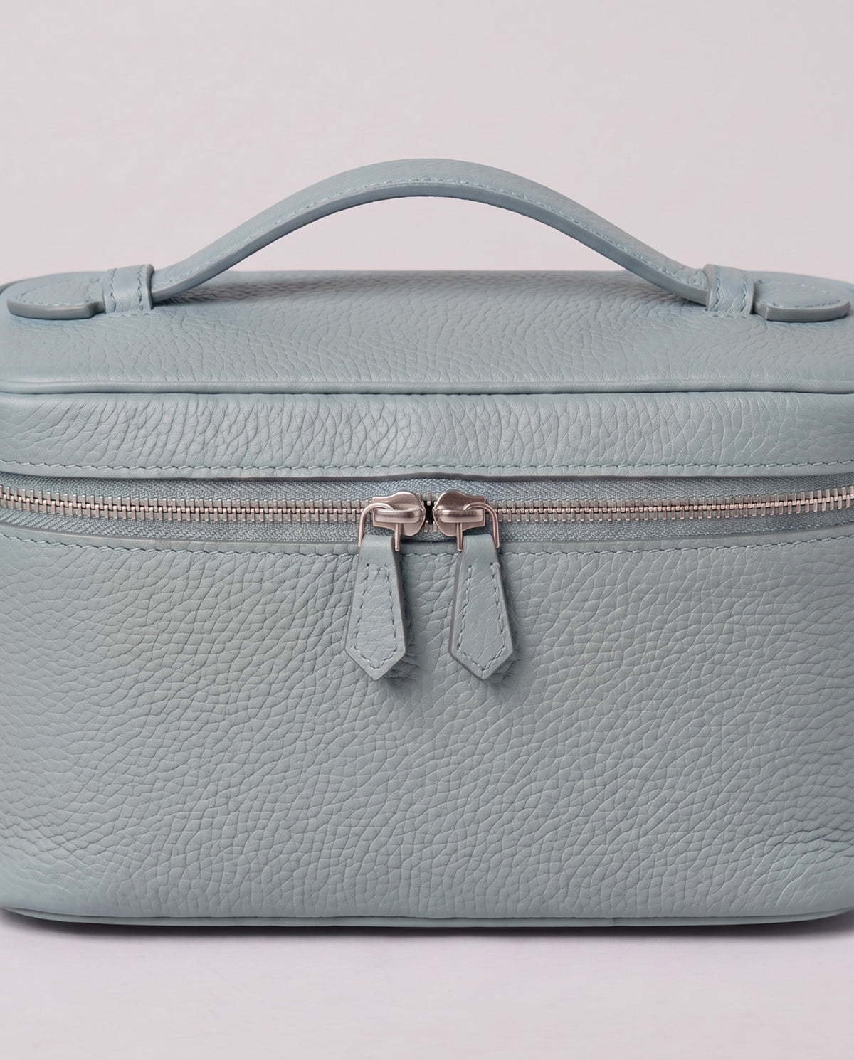 Silver zip and handle detail on the Valentina Orvieto Small bag in Blue leather