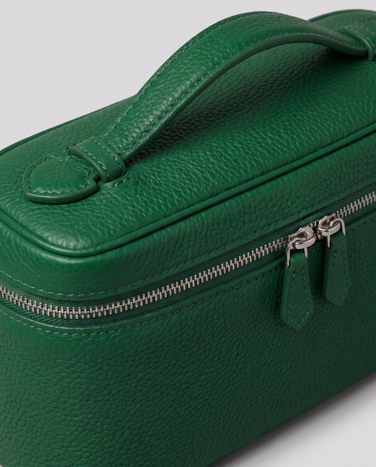 Close-up of the pebbled cowhide leather on the Orvieto vanity case in Green