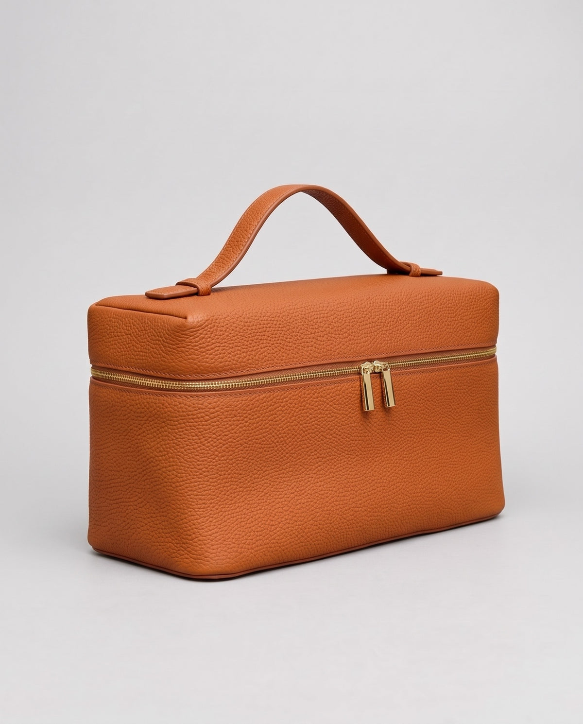 Orvieto pebbled leather vanity case in Cognac – three-quarter view