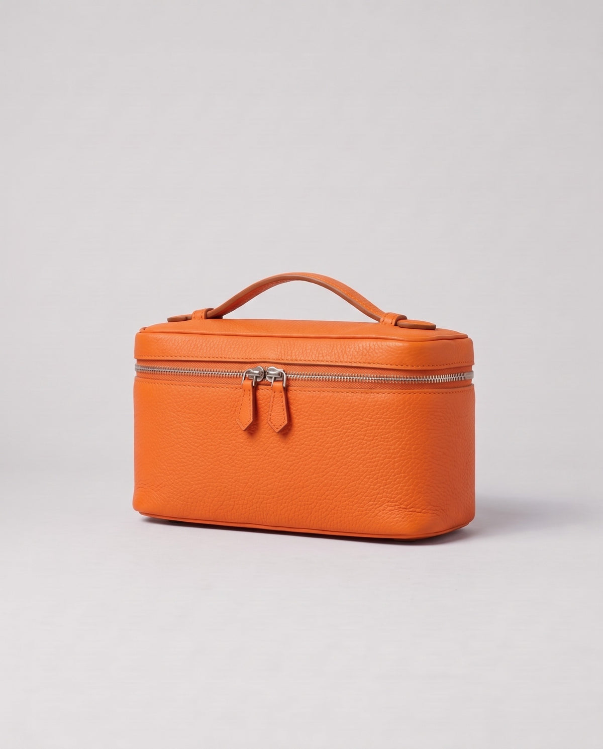 Orvieto pebbled leather vanity case in Orange – three-quarter view