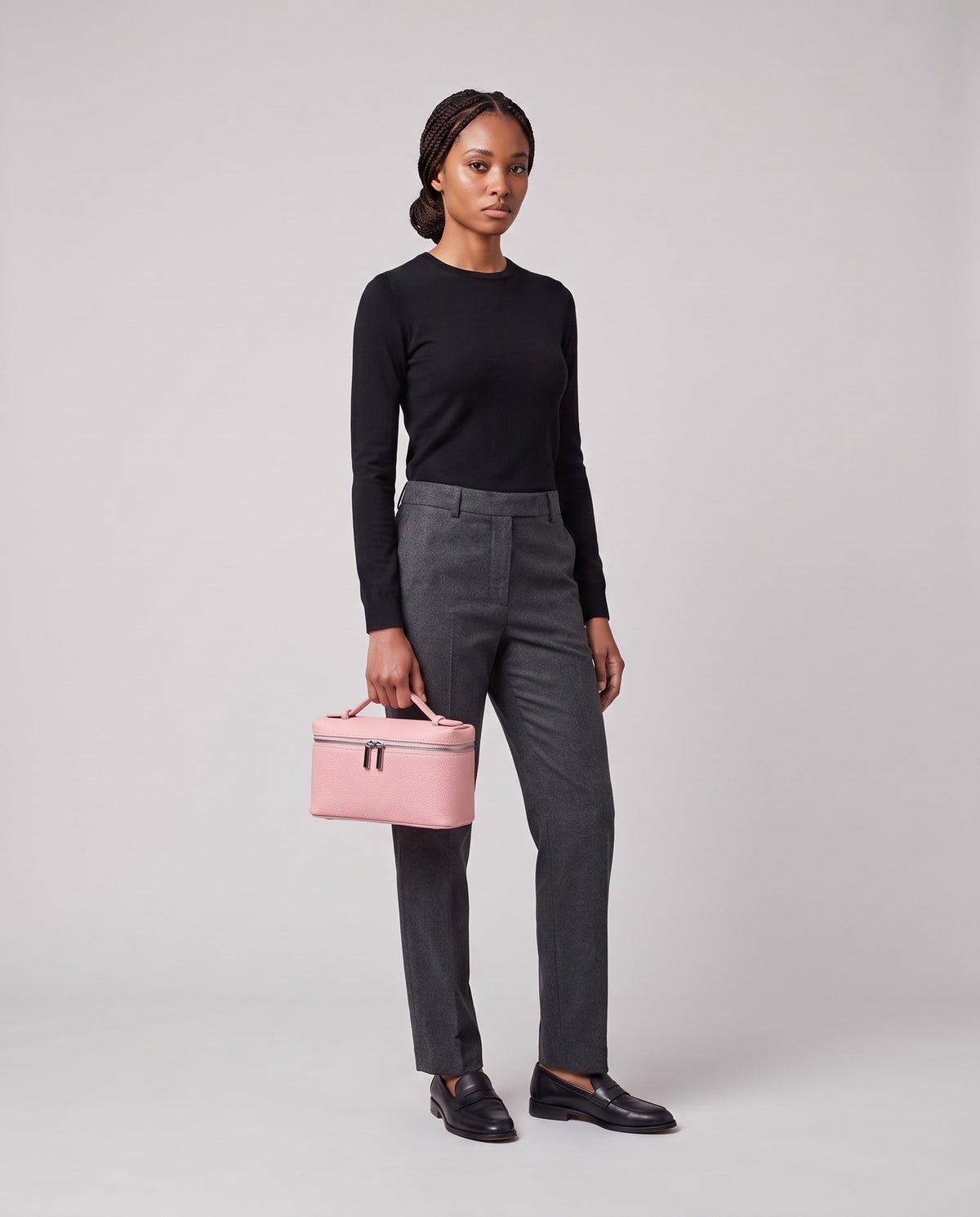 Model holding the Valentina Orvieto Small top-handle bag in Pink leather, full length