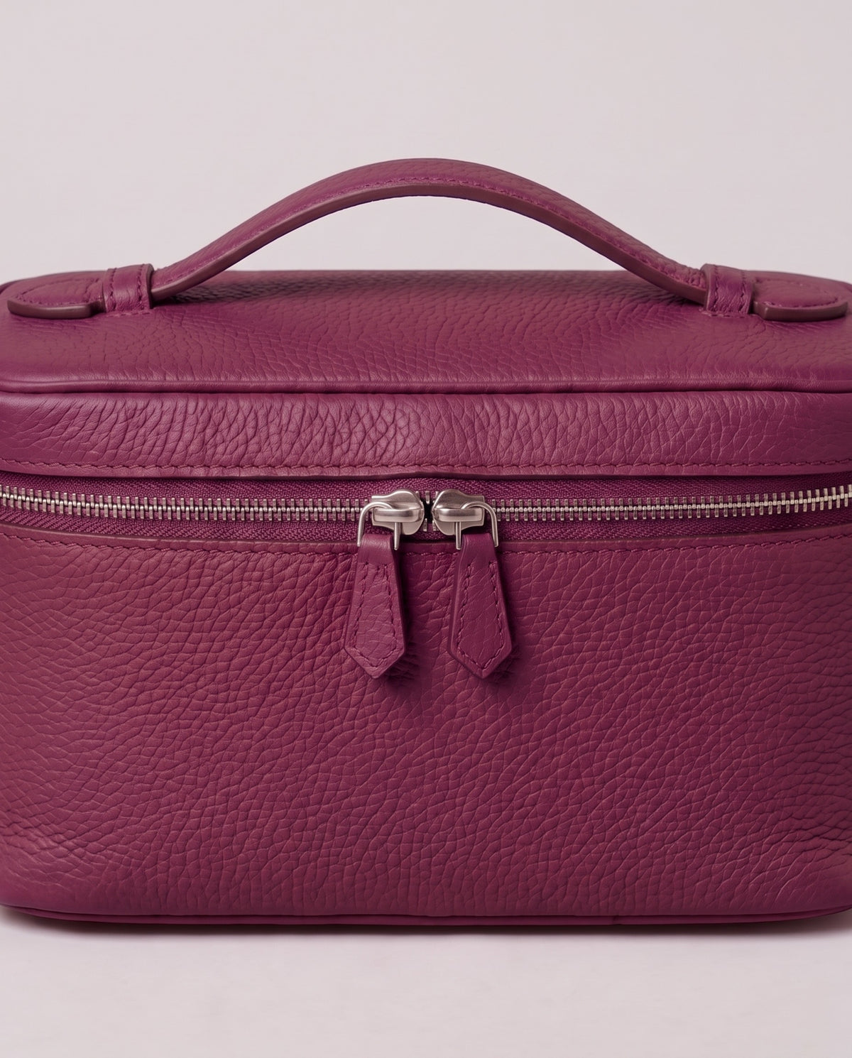 Silver zip and handle detail on the Valentina Orvieto Small bag in Purple leather