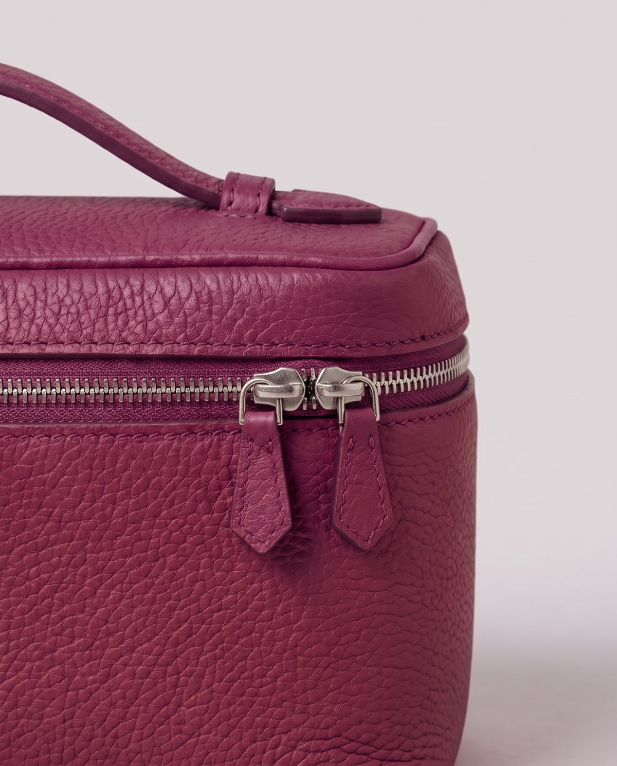Pebbled leather close-up of the Valentina Orvieto Small bag in Purple