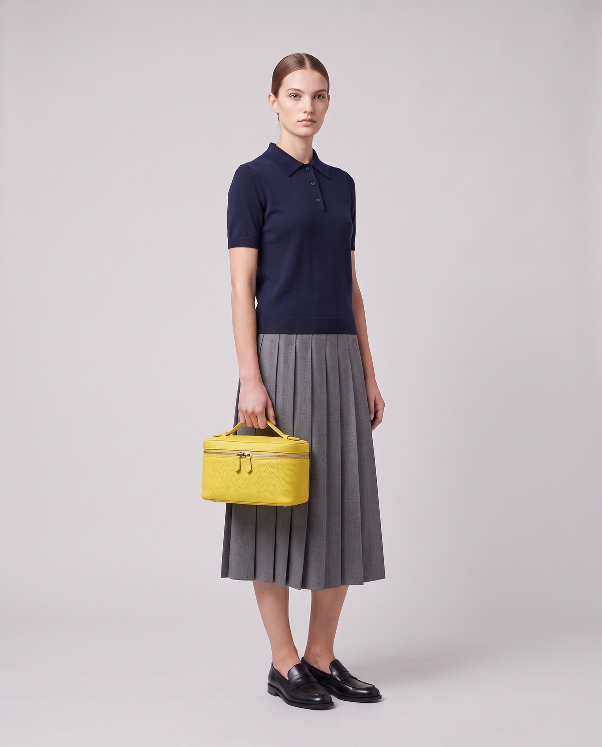 Model carrying the Orvieto vanity case in Yellow
