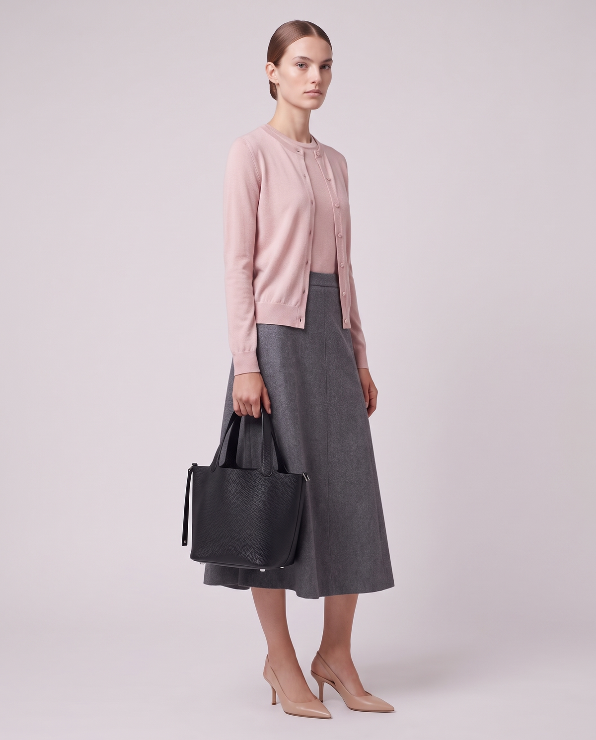 Model carrying the Valentina Ostuni Large bag in Black
