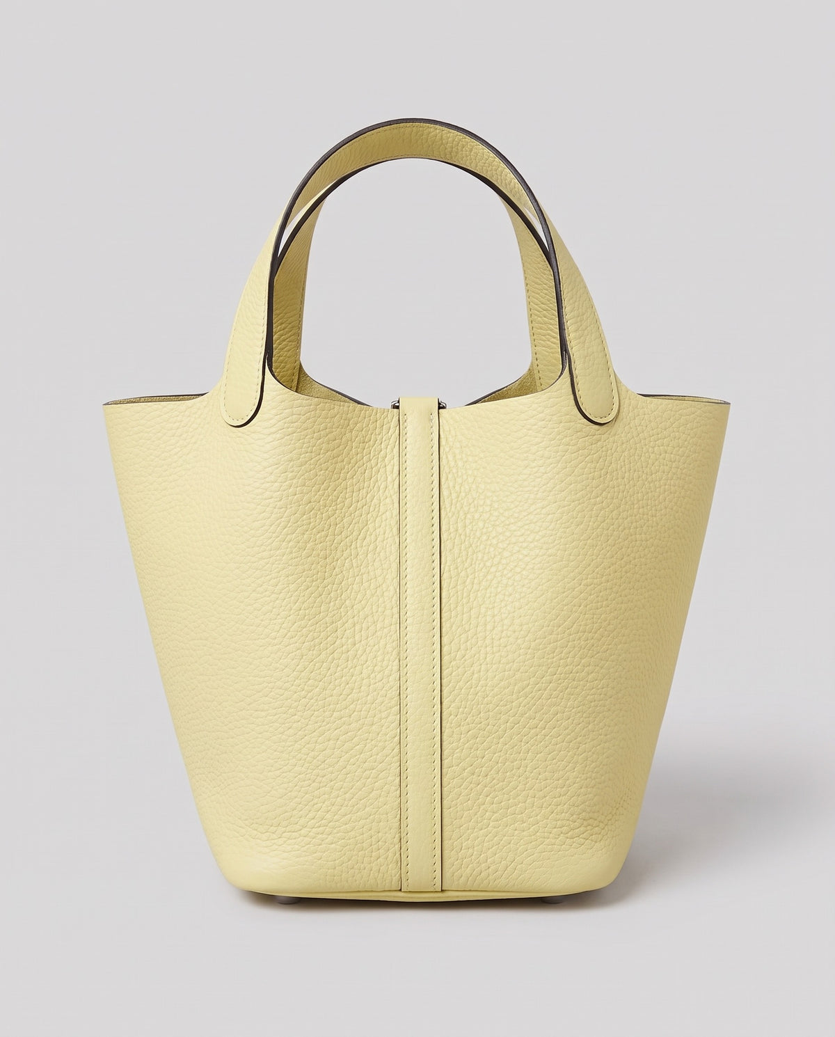 Hardware and handle detail on the Valentina Ostuni Large bag in Butter