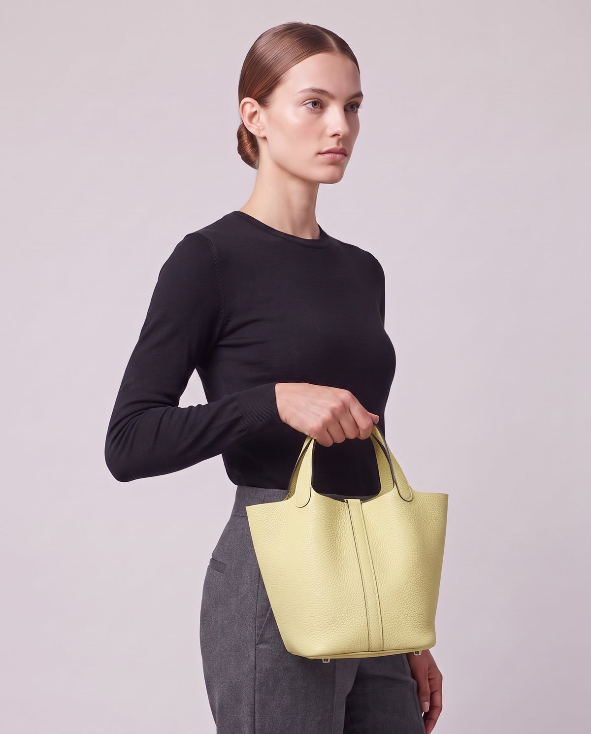 Model carrying the Valentina Ostuni Large bag in Butter