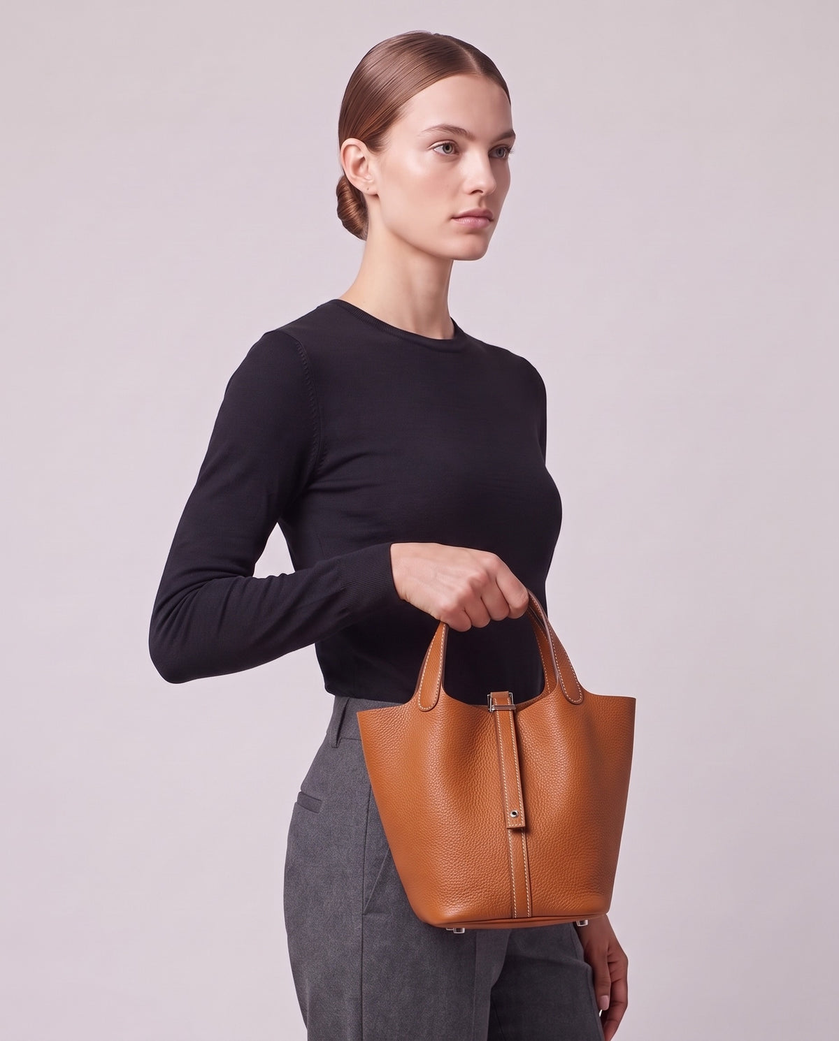 Model carrying the Valentina Ostuni Large bag in Cognac