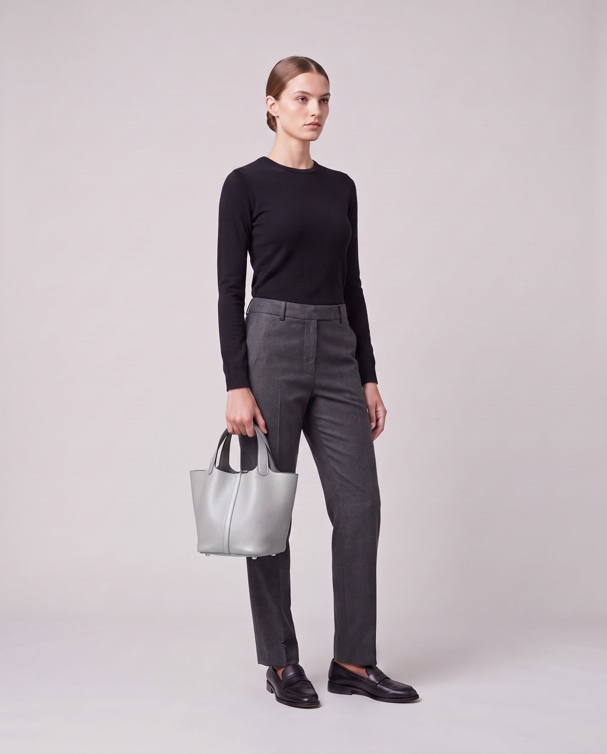 Model holding the Valentina Ostuni Large bag in Silver, full length