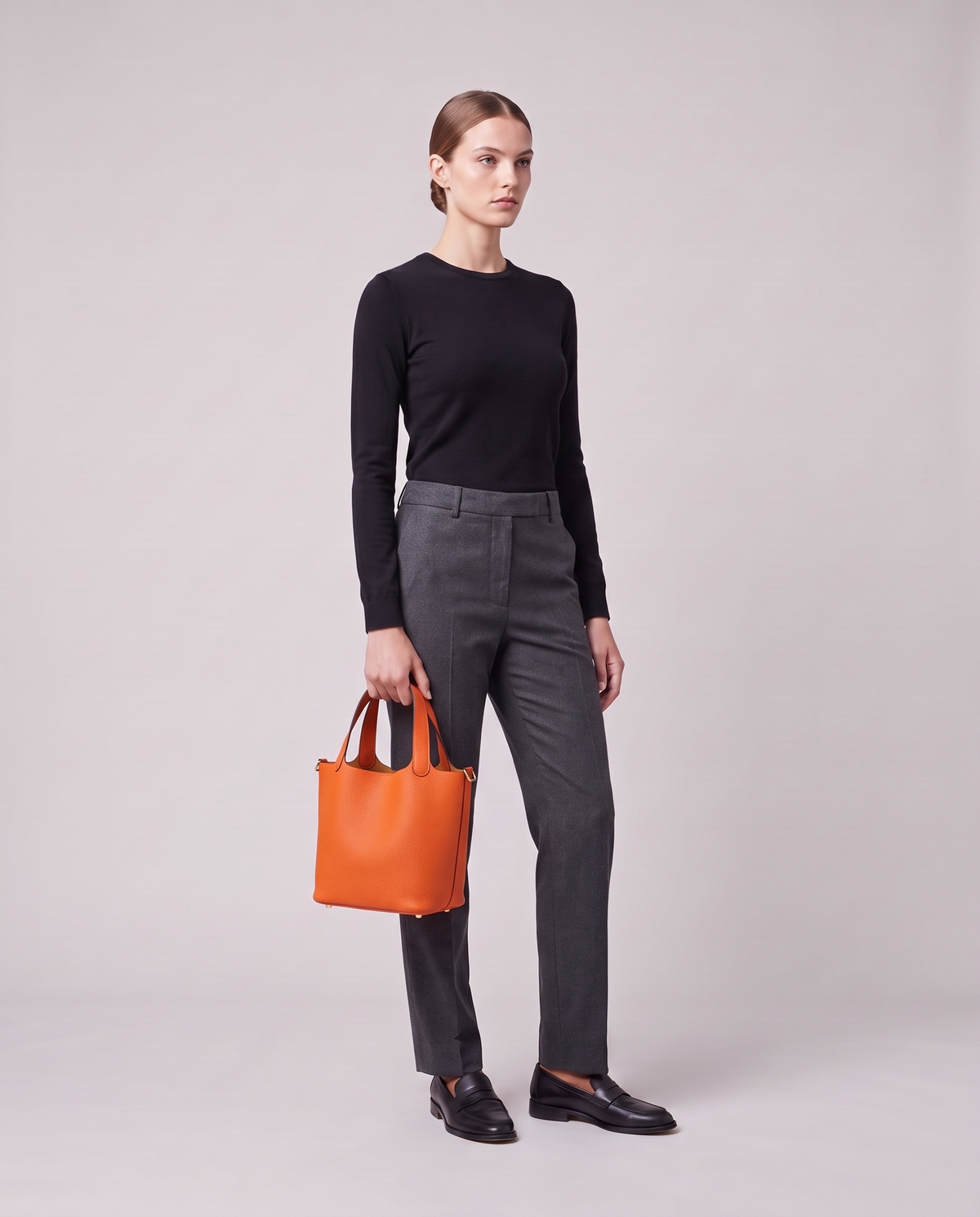 Model holding the Valentina Ostuni Small bag in Orange, full length