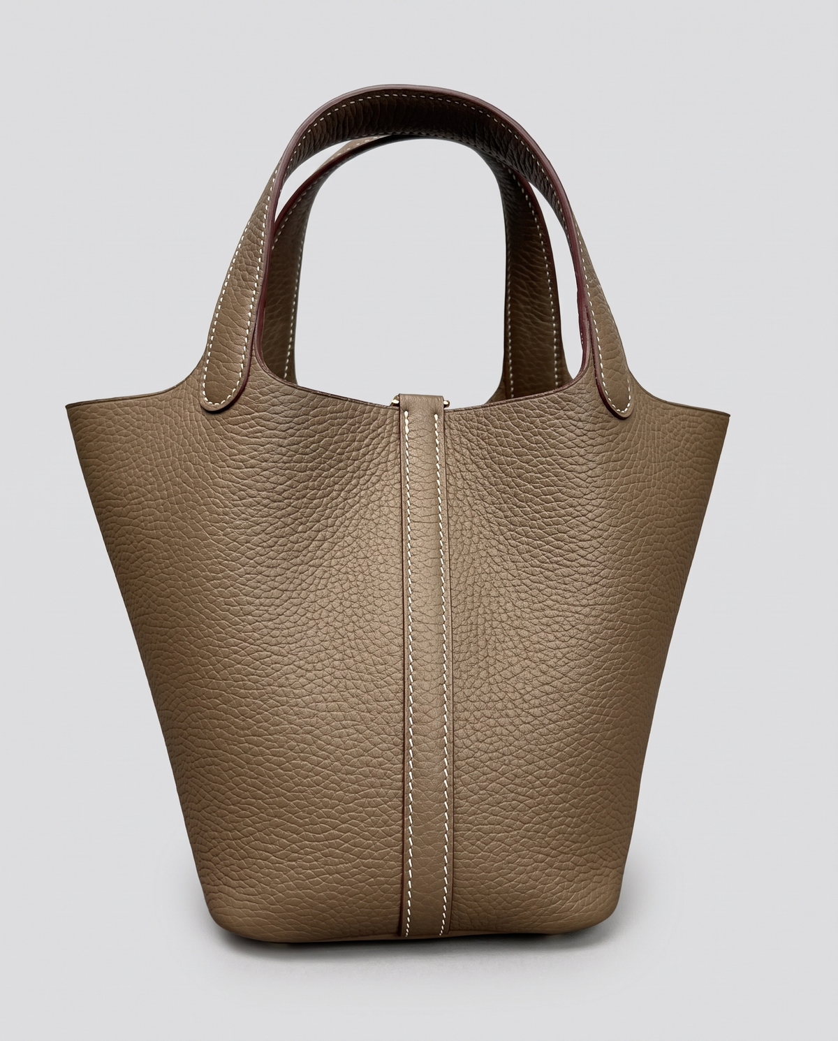 Hardware and handle detail on the Valentina Ostuni Small bag in Taupe