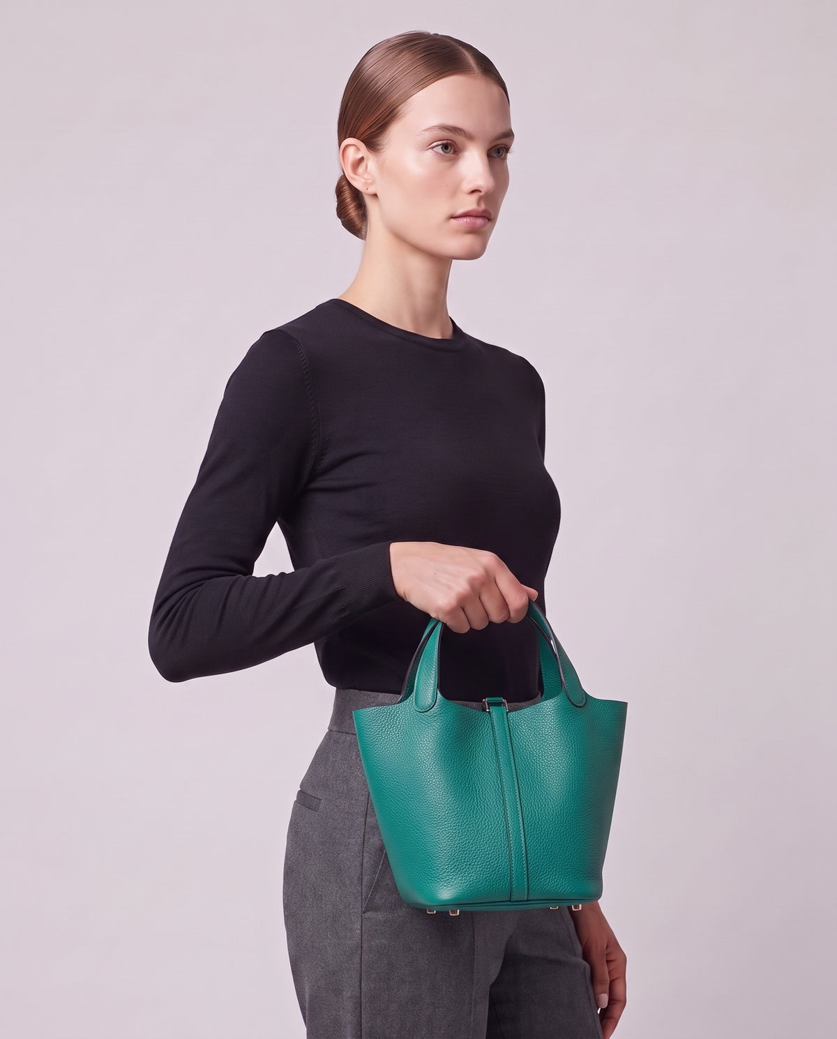 Model carrying the Valentina Ostuni Small bag in Teal
