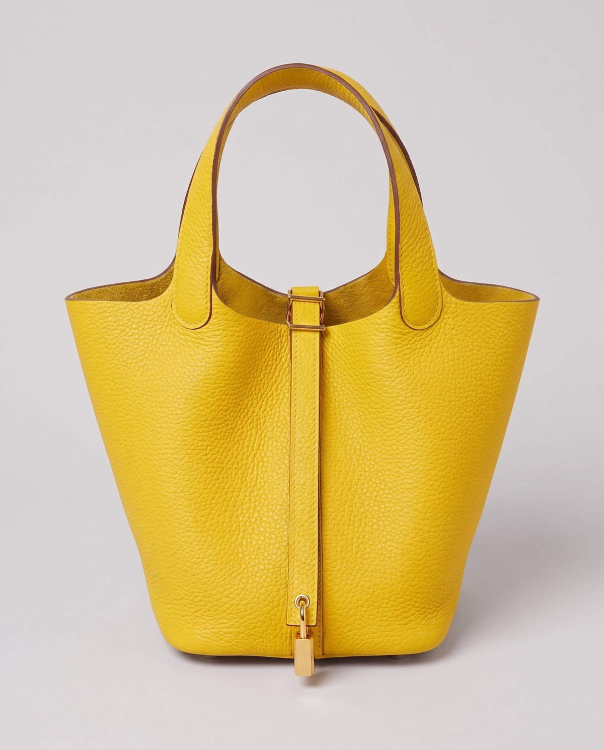 Hardware and handle detail on the Valentina Ostuni Small bag in Yellow