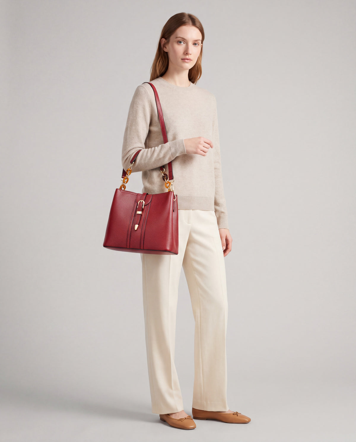 Outline bag in Red – worn by model, full length