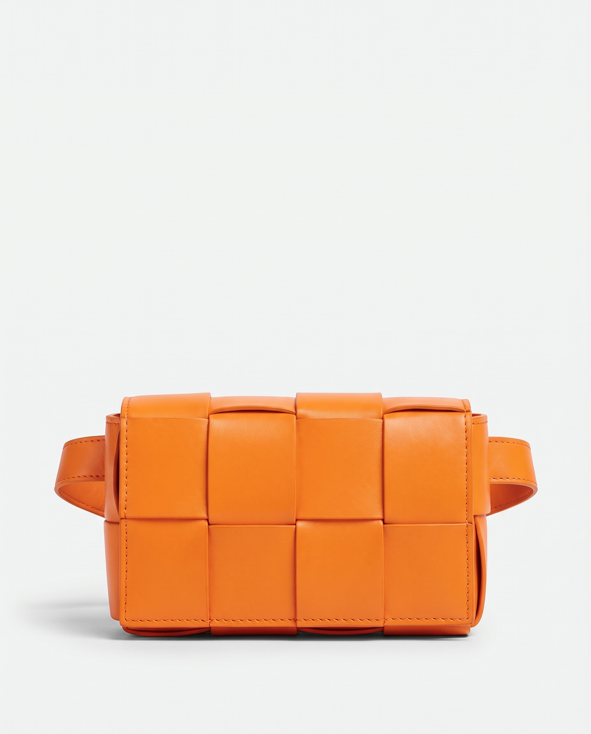 Cassette padded woven leather belt bag in Orange – front view