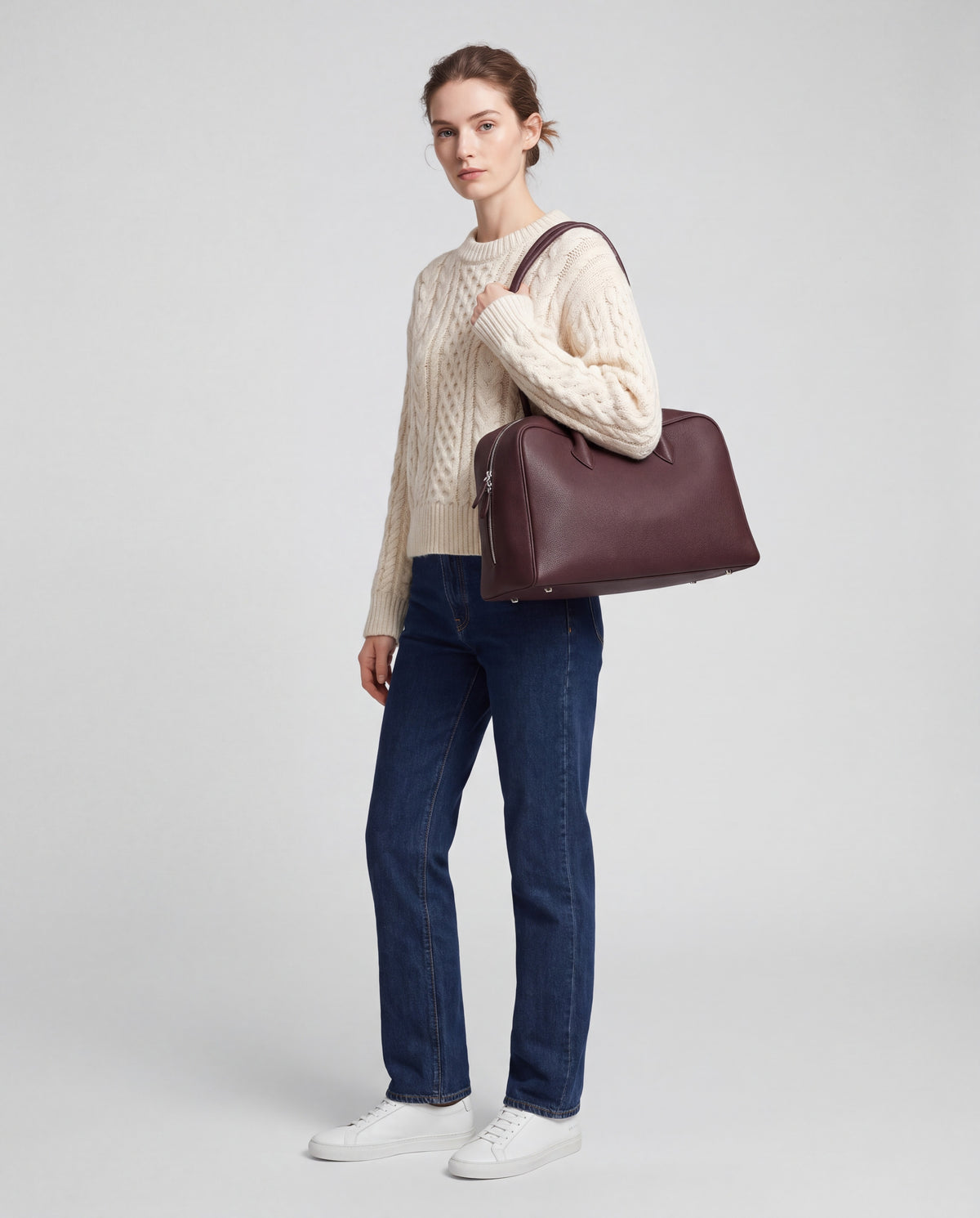 Pillow bag in Chocolate – worn by model, full length