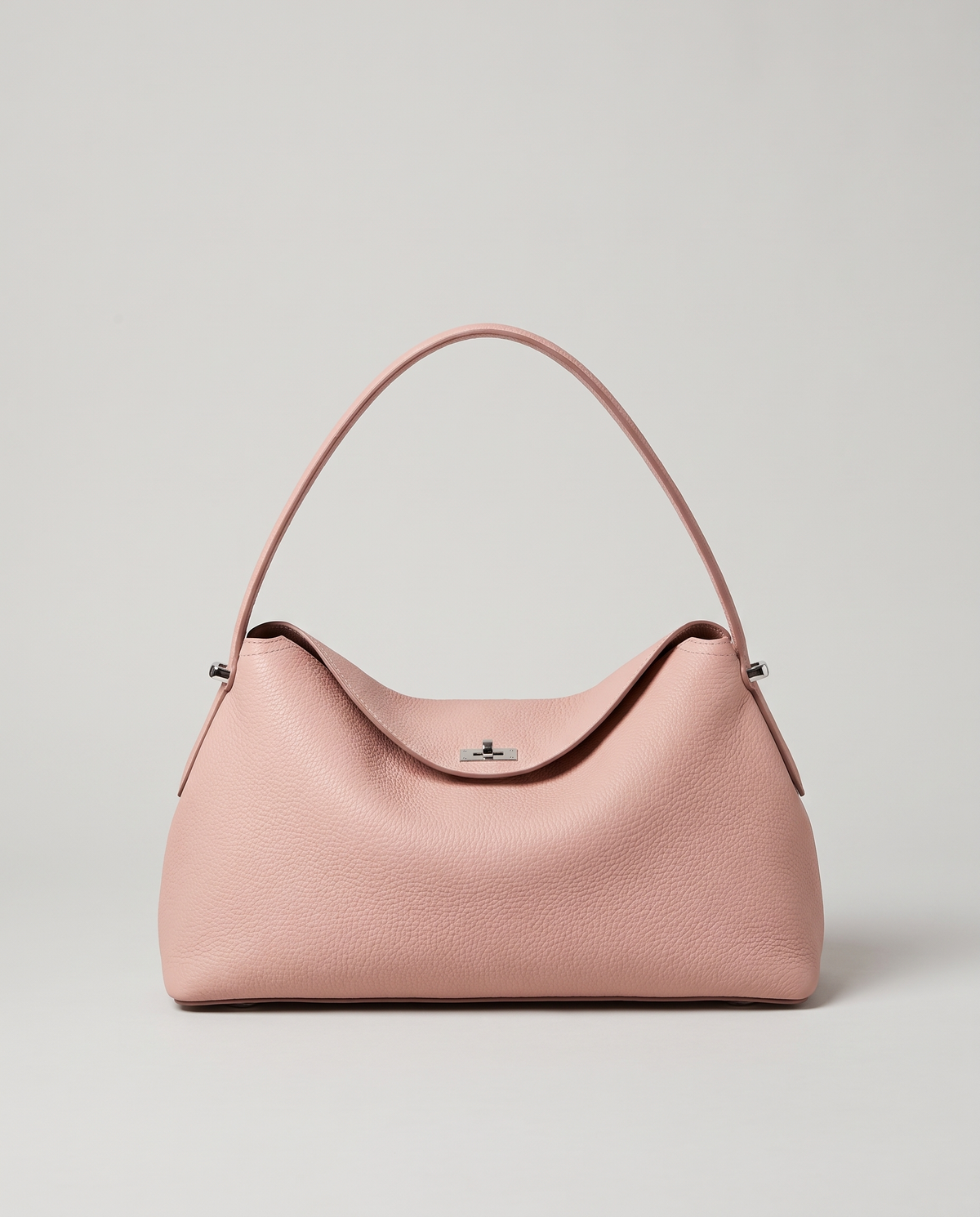 Porto pebbled leather top-handle bag in blush pink, front view