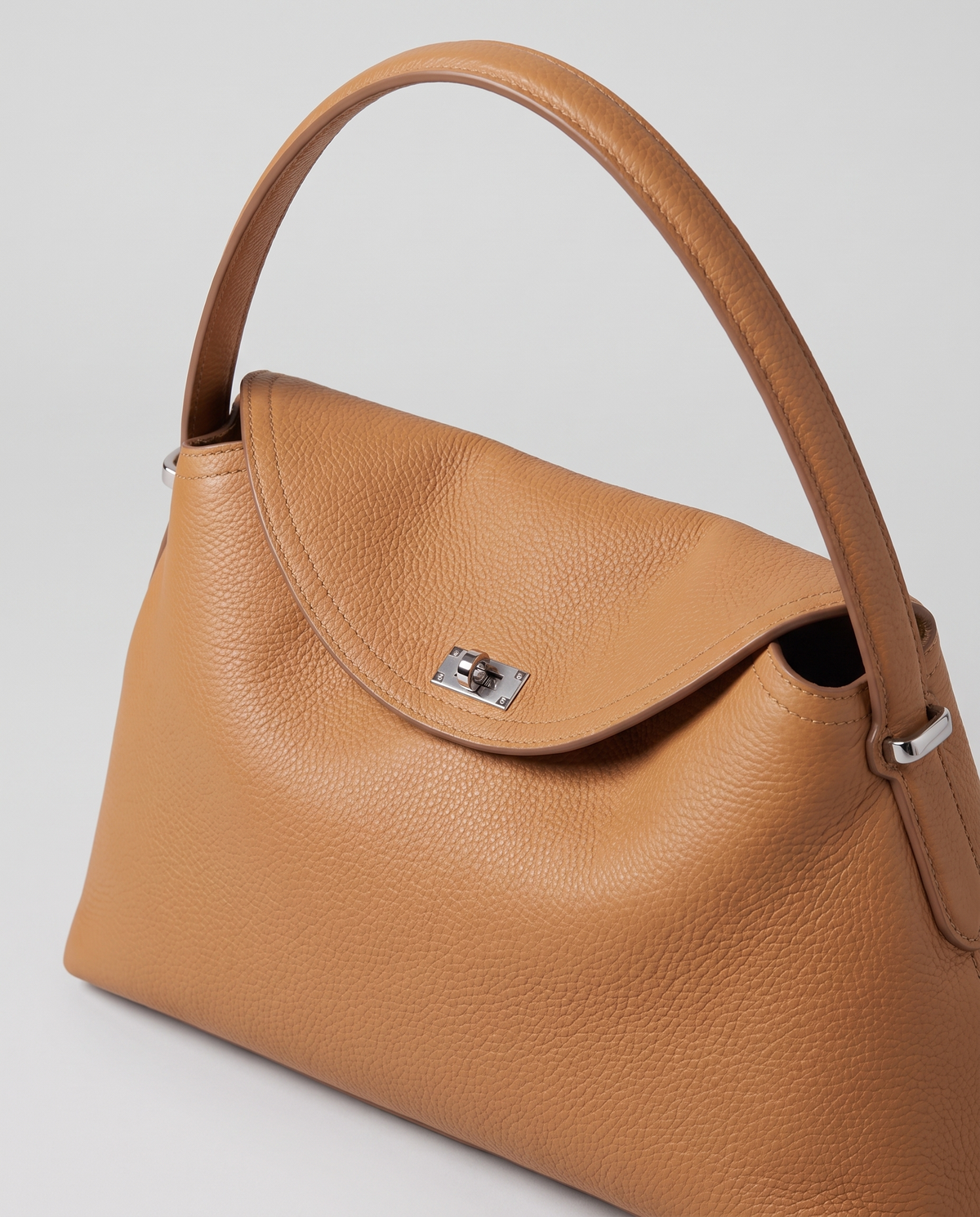 Porto pebbled leather top-handle bag in camel, hardware and leather detail