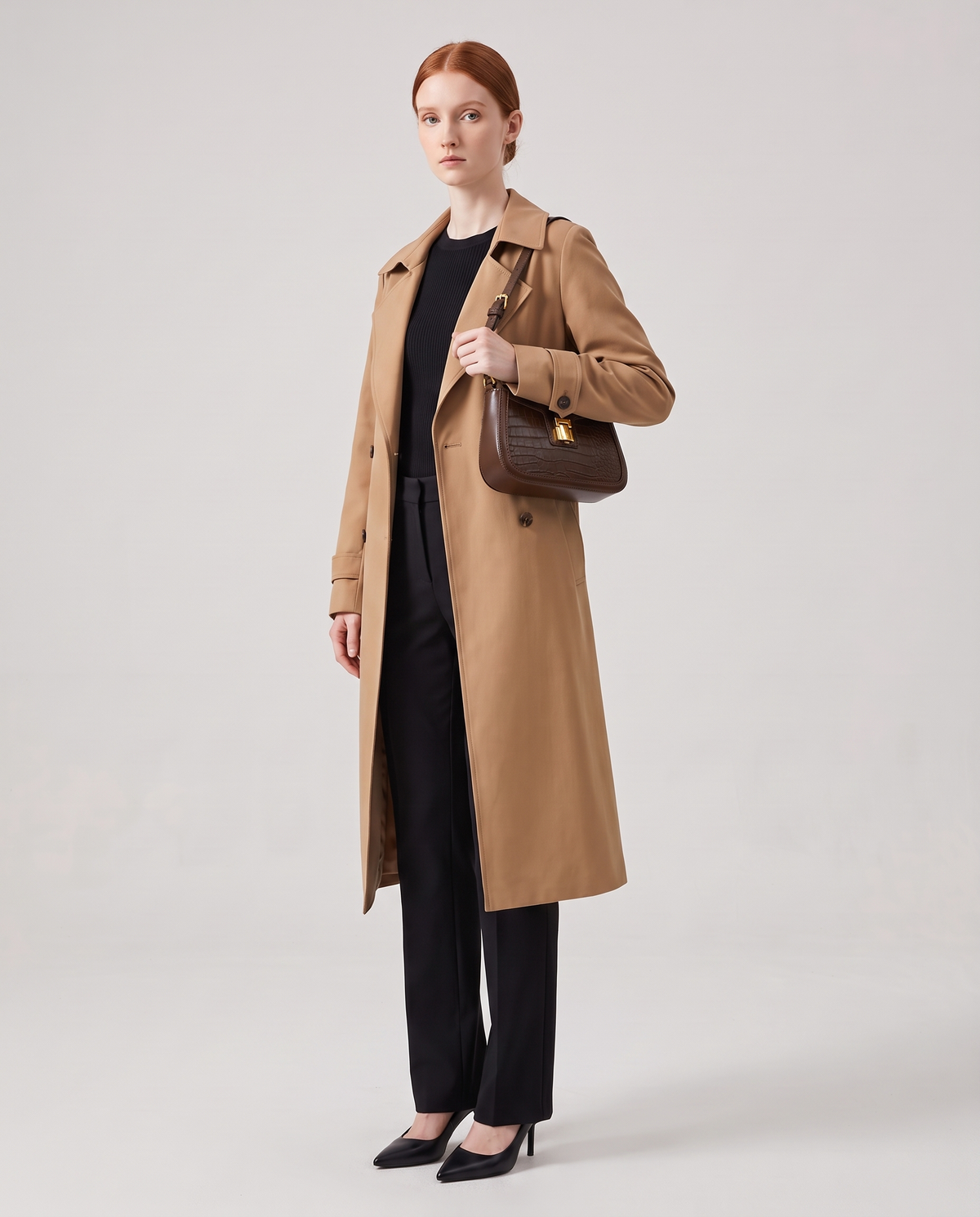 Sable croc-embossed shoulder bag in Brown – model wearing it on her shoulder, full length