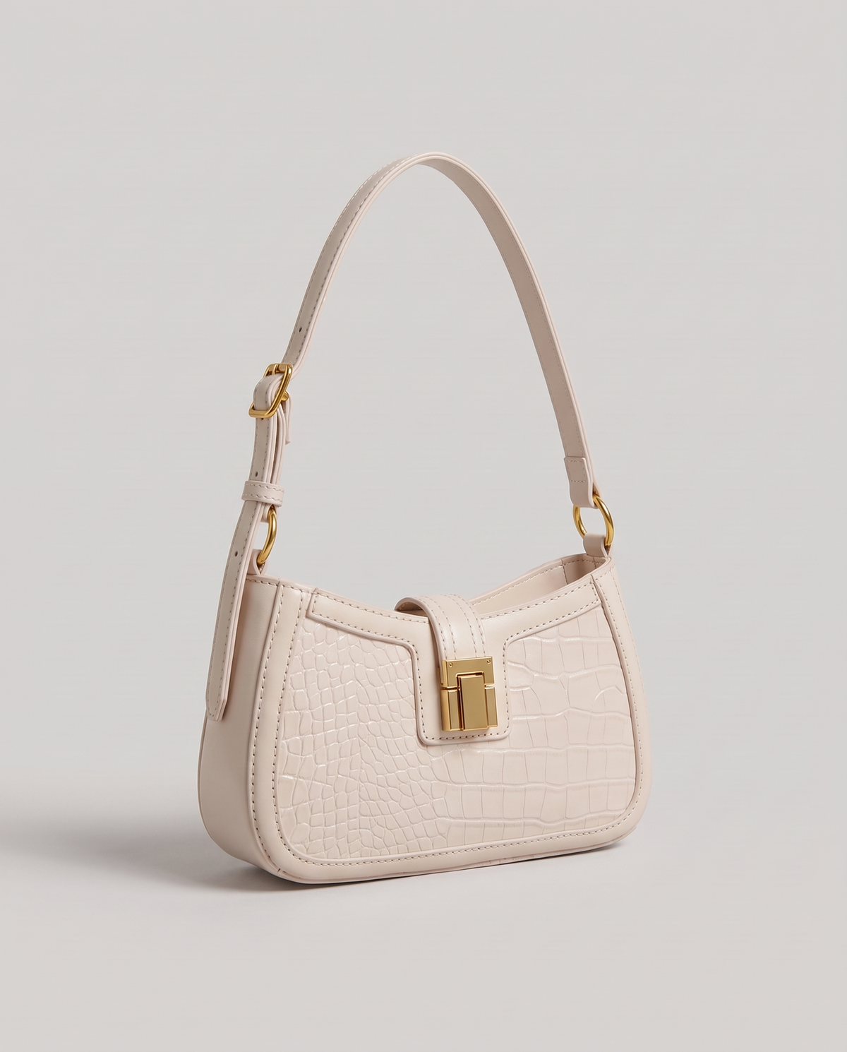 Sable croc-embossed shoulder bag in Chalk – three-quarter view