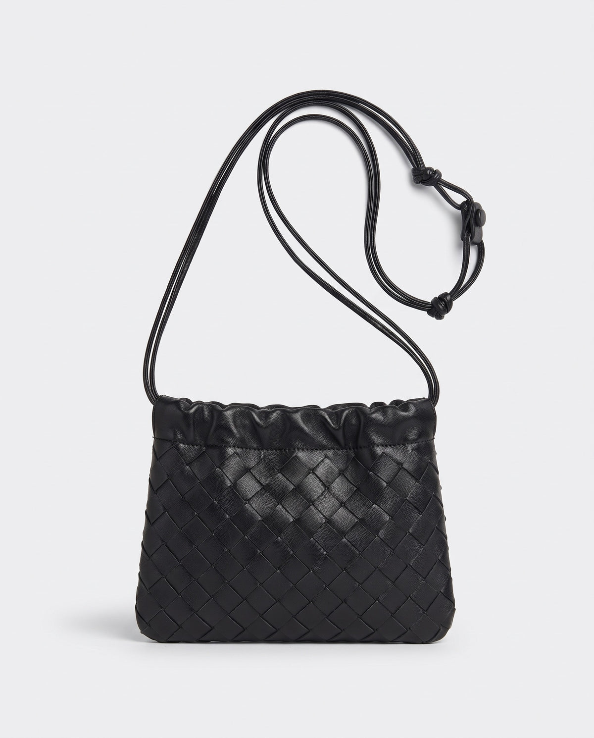 Serata woven leather clutch in black – front view