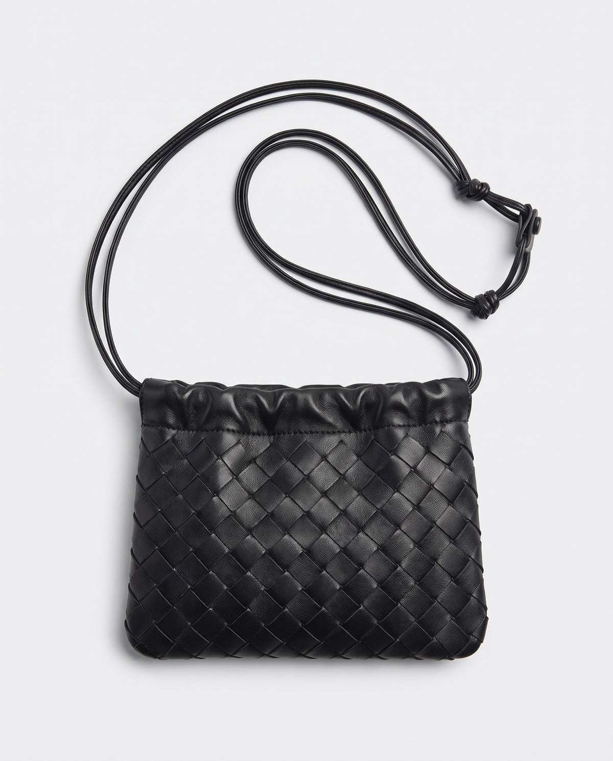 Serata woven leather clutch in black – back view