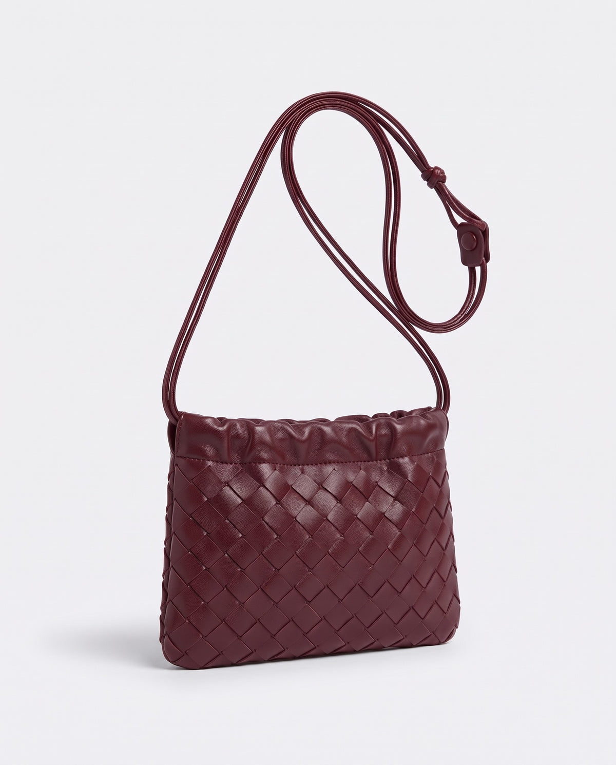 Serata woven leather clutch in Burgundy – three-quarter view