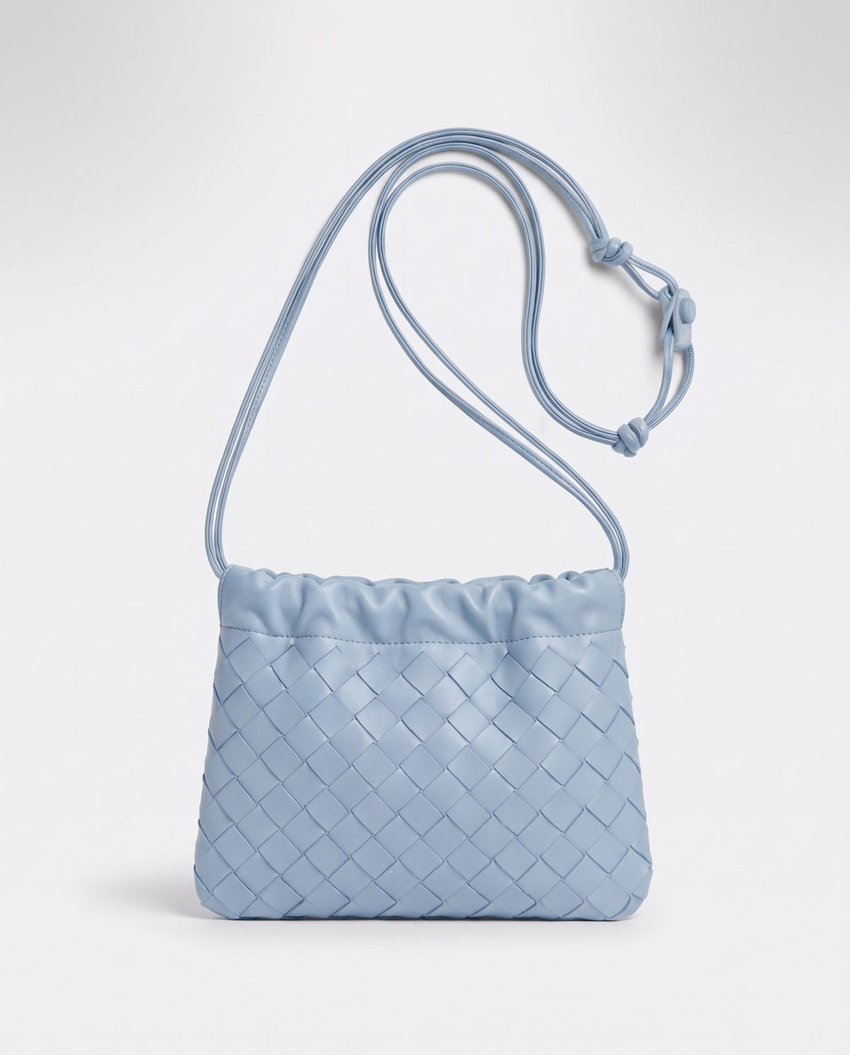 Serata woven leather clutch in Sky – front view