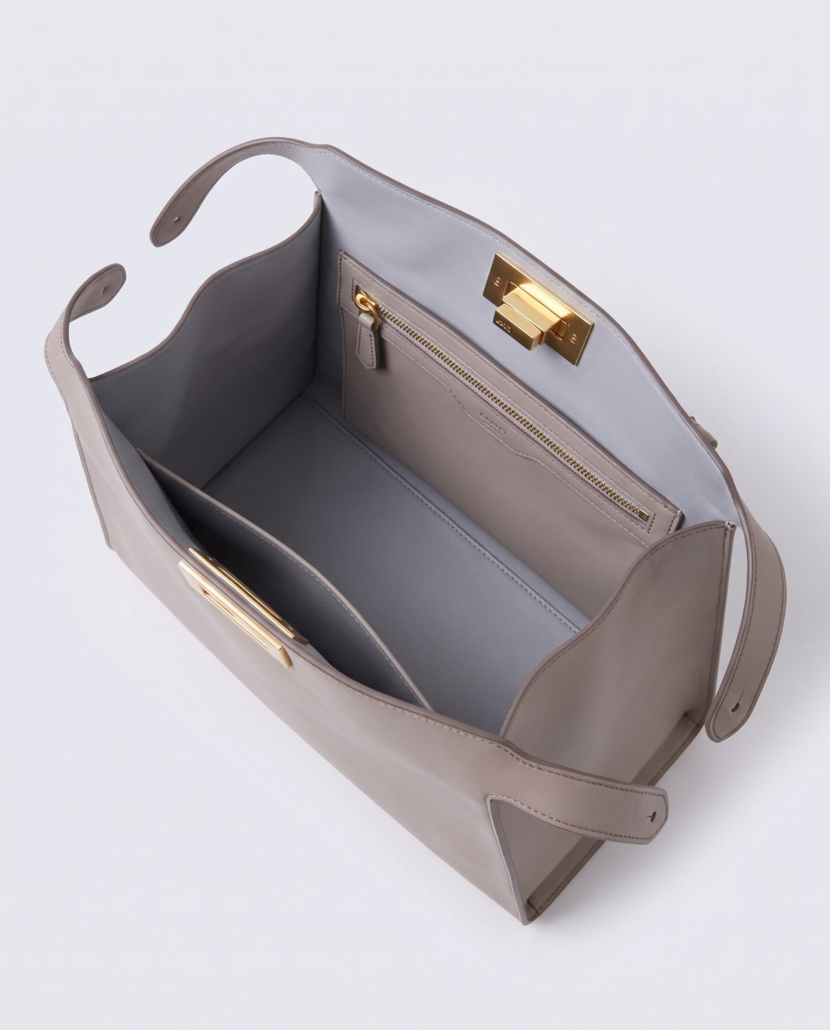 Siracusa leather bag in Stone – inside view with lining and pockets