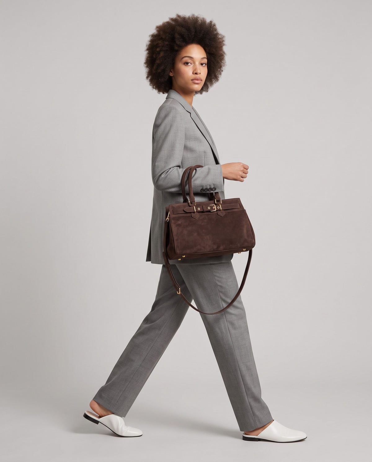 Model wearing the Spello top-handle bag in Chocolate – full-length view