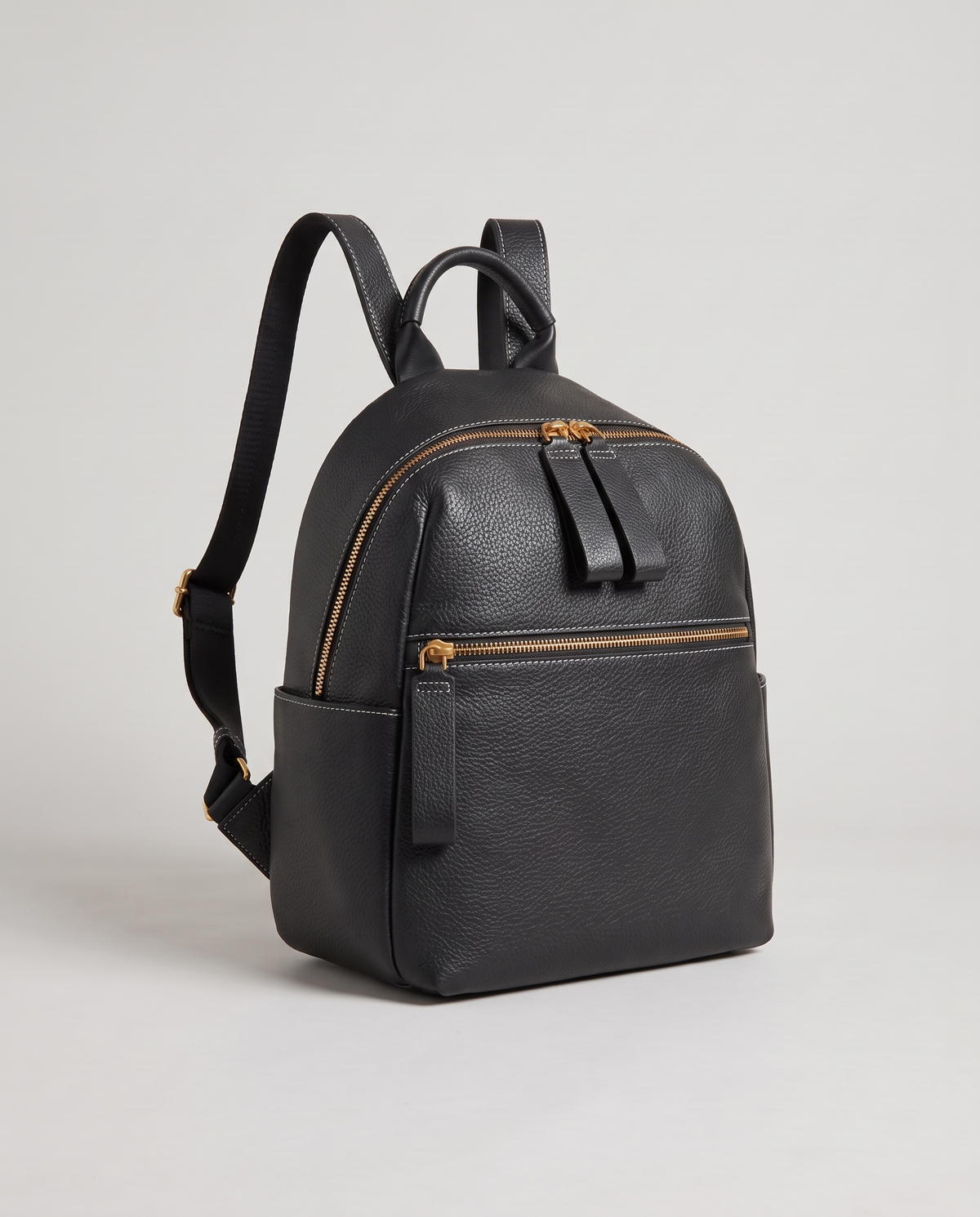 Tab pebbled leather backpack in Black – three-quarter view