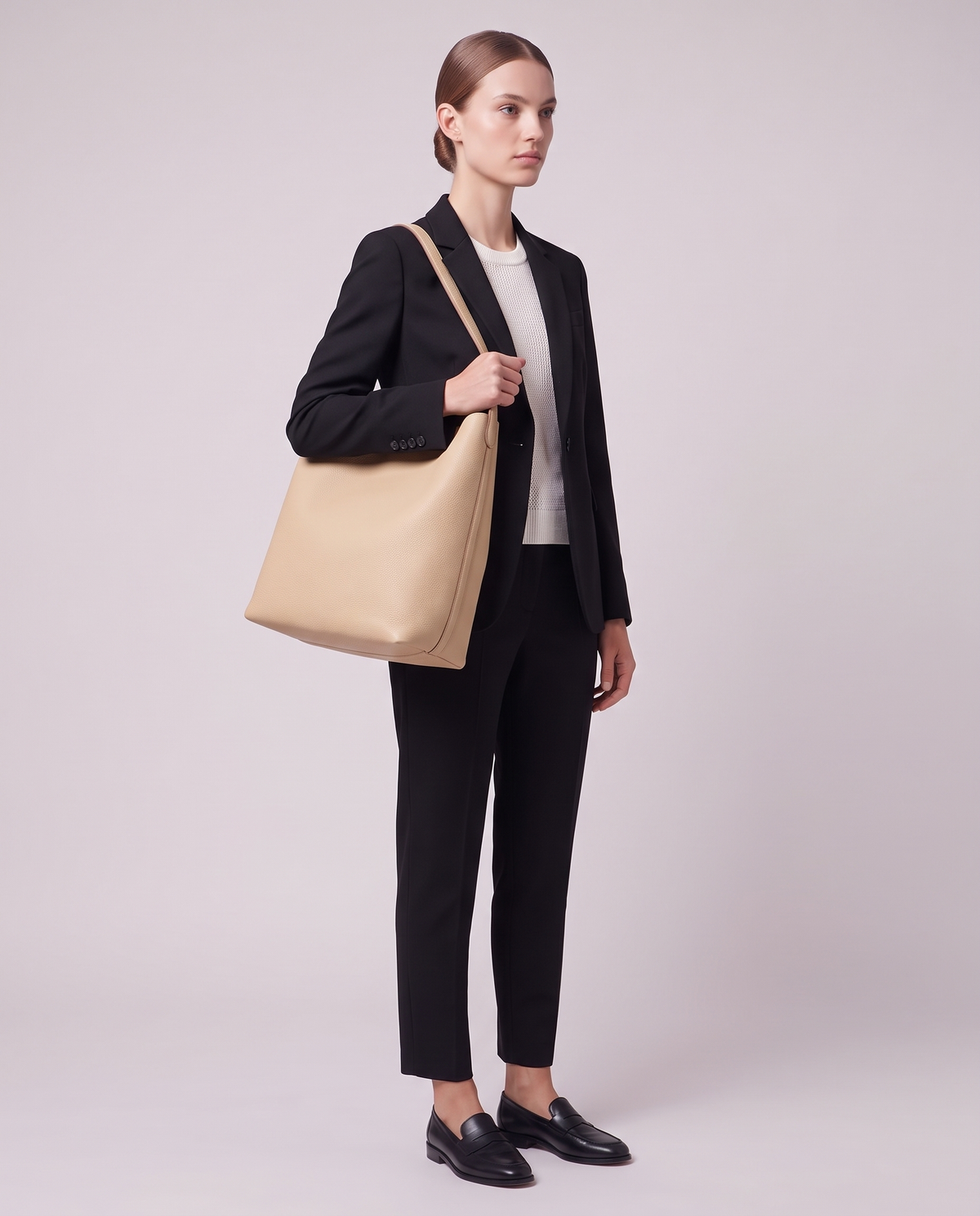 Model carrying the Valentina Tela Large bag in Beige