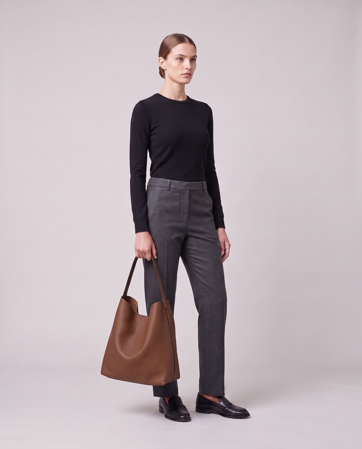 Model holding the Valentina Tela Large bag in Brown, full length