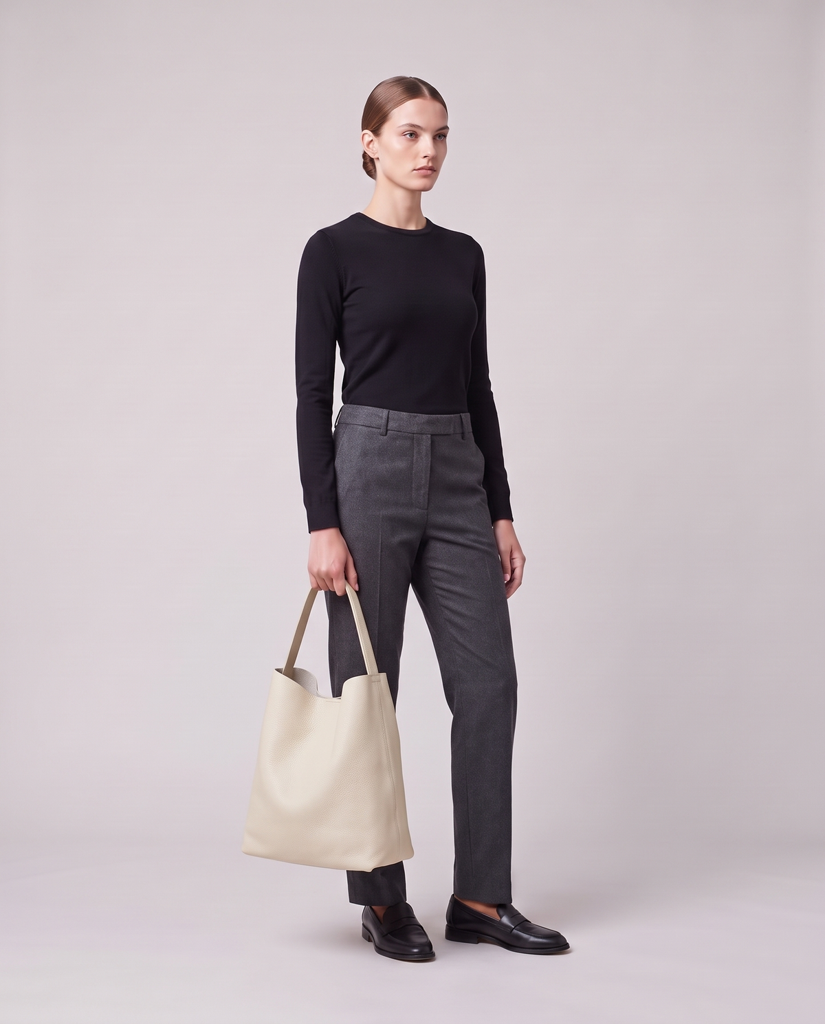 Model holding the Valentina Tela Large bag in Cream, full length