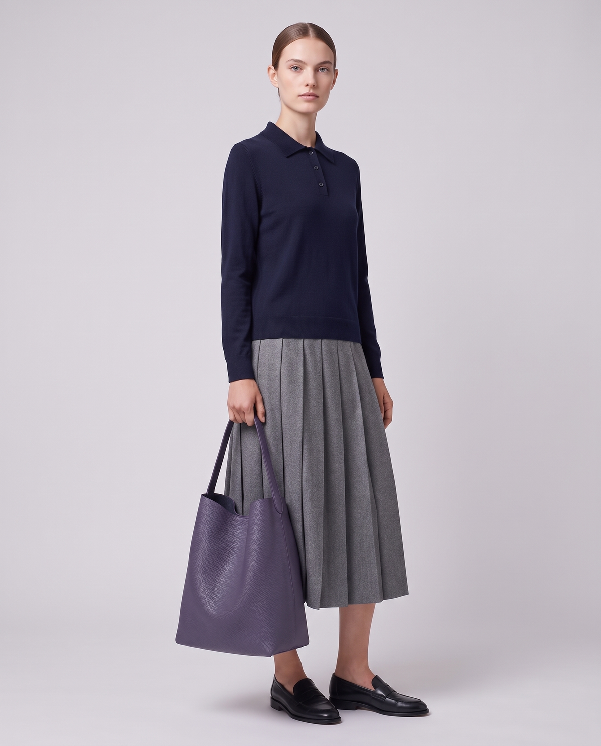 Model carrying the Valentina Tela Small bag in Purple