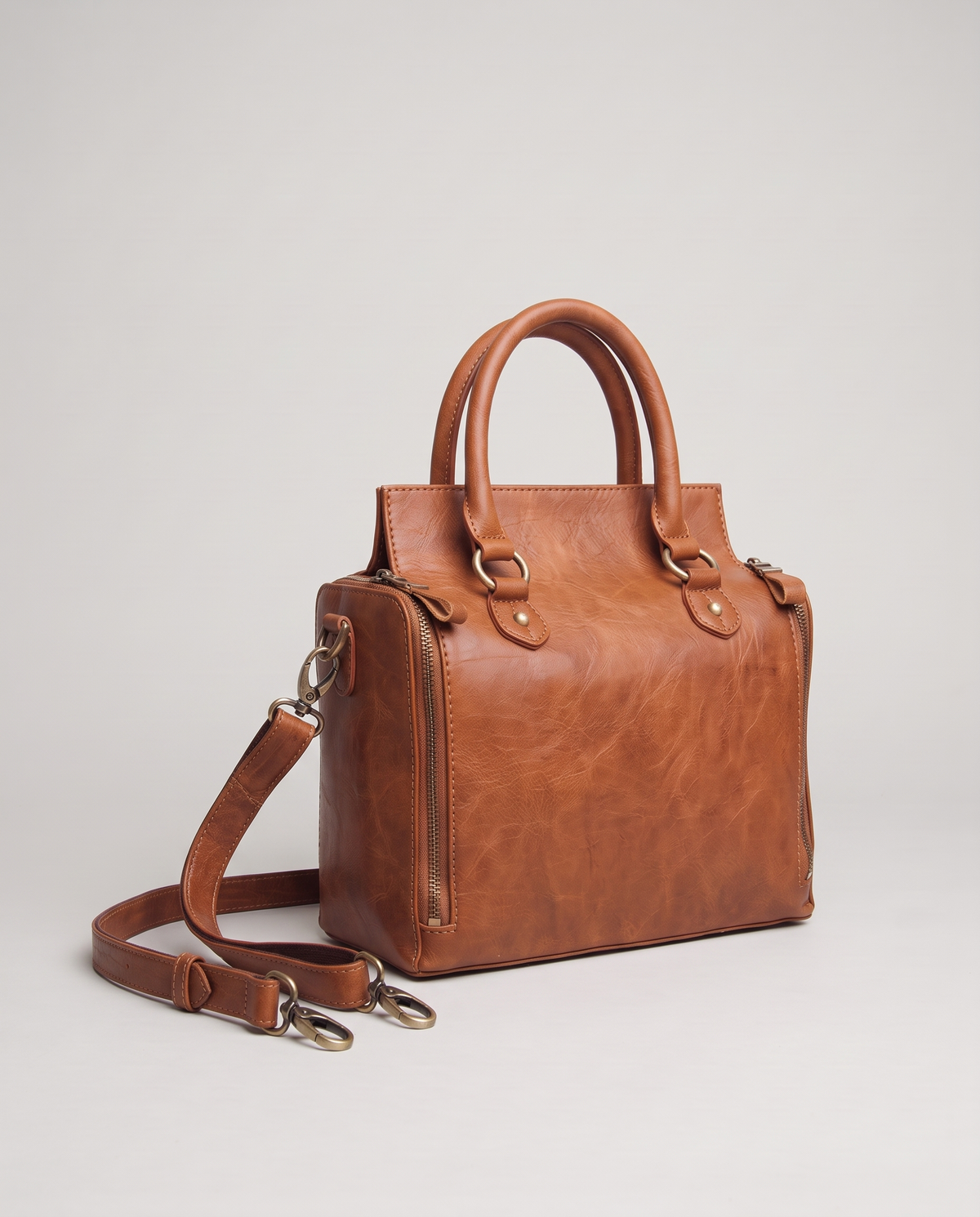Terra leather satchel in Brown – three-quarter view with the shoulder strap