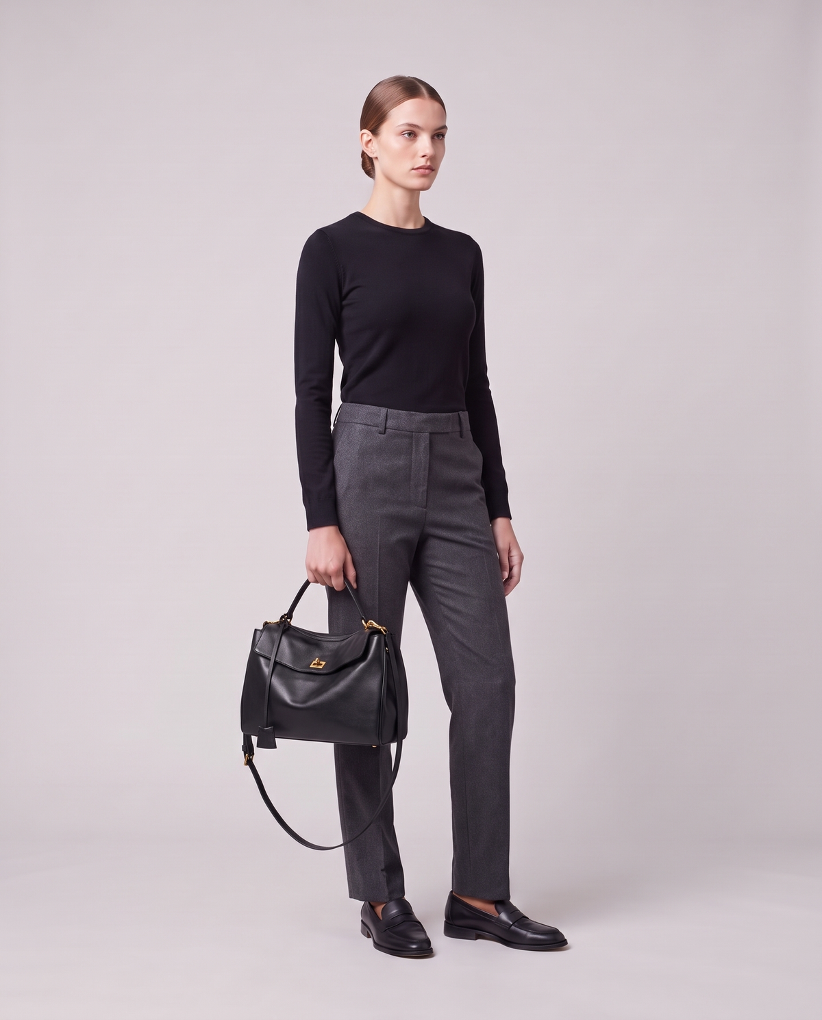 Model holding the Valentina Tinto Large bag in Black, full length