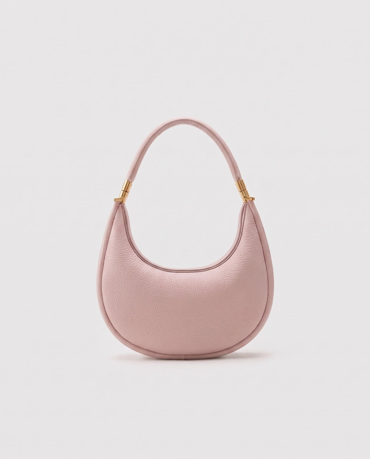 Todi pebbled leather crescent bag in Blush – back view