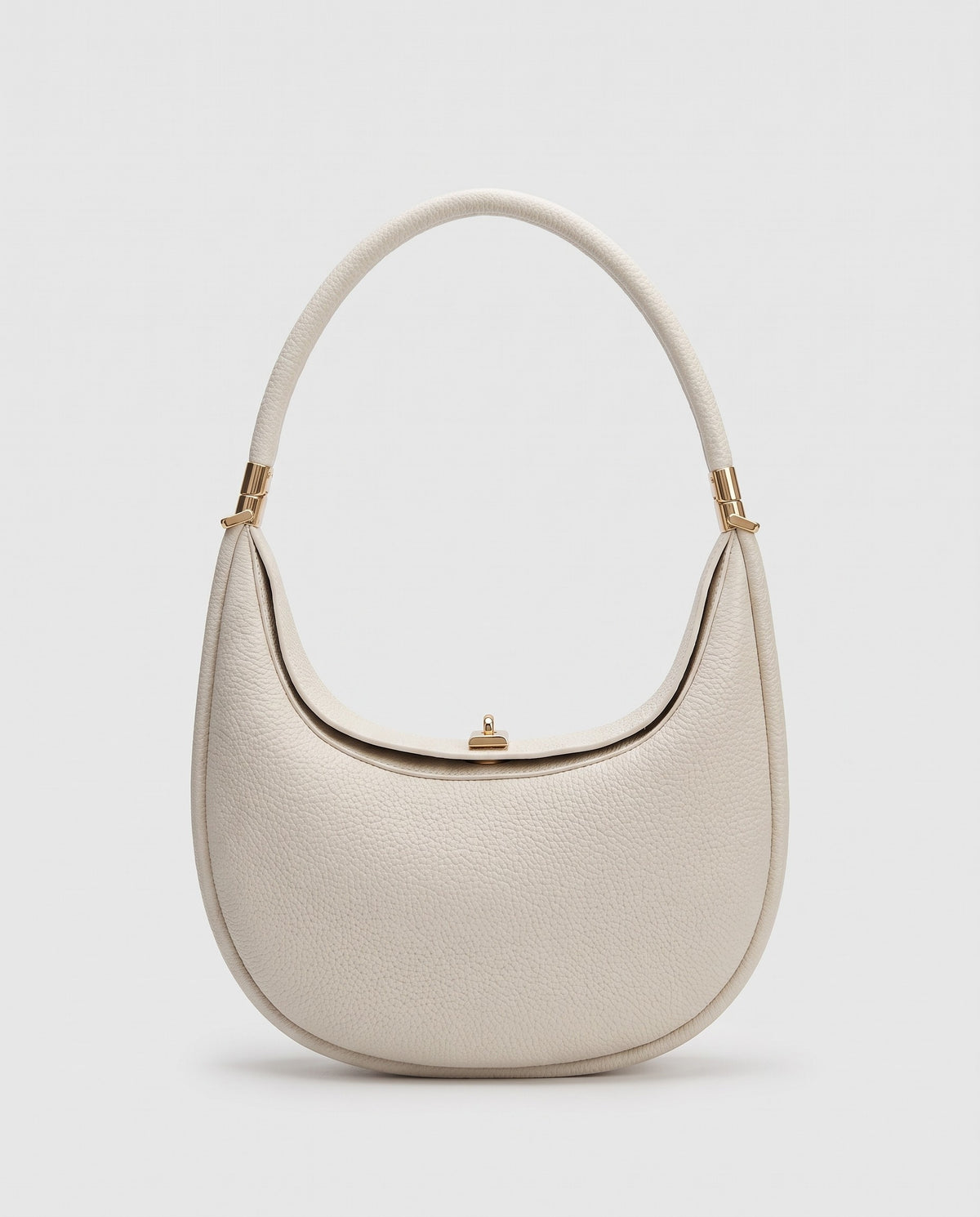 Todi pebbled leather crescent bag in Ivory – front view