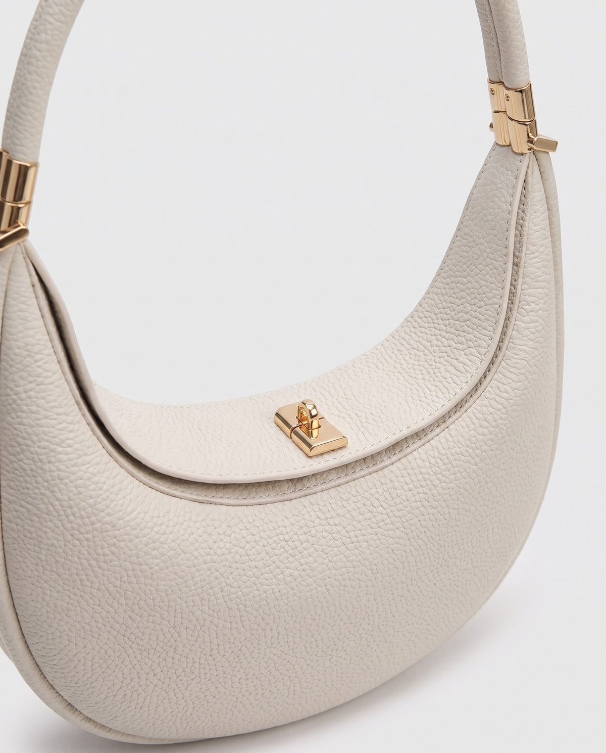 Close-up of the pebbled cowhide leather on the Todi bag in Ivory