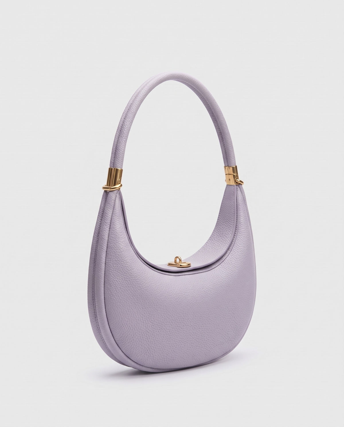 Todi pebbled leather crescent bag in Lavender – three-quarter view