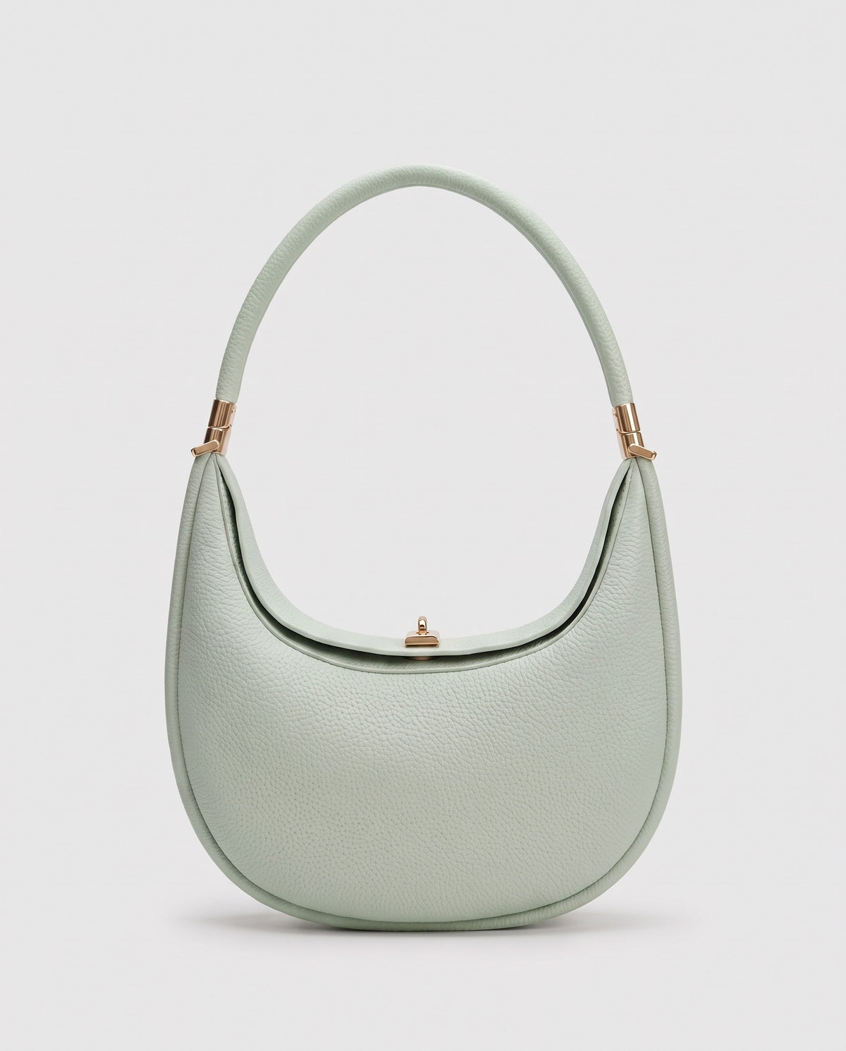Todi pebbled leather crescent bag in Mint – front view