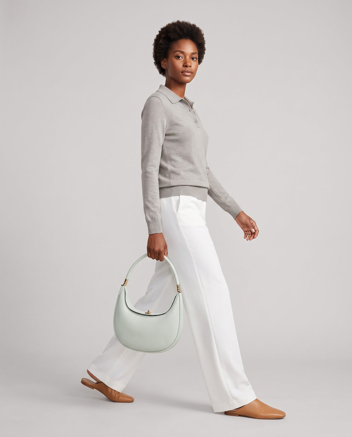 Model wearing the Todi crescent bag in Mint – full-length view