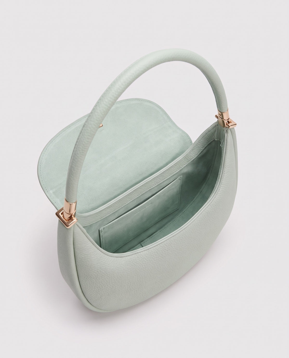 Inside view of the Todi crescent bag in Mint